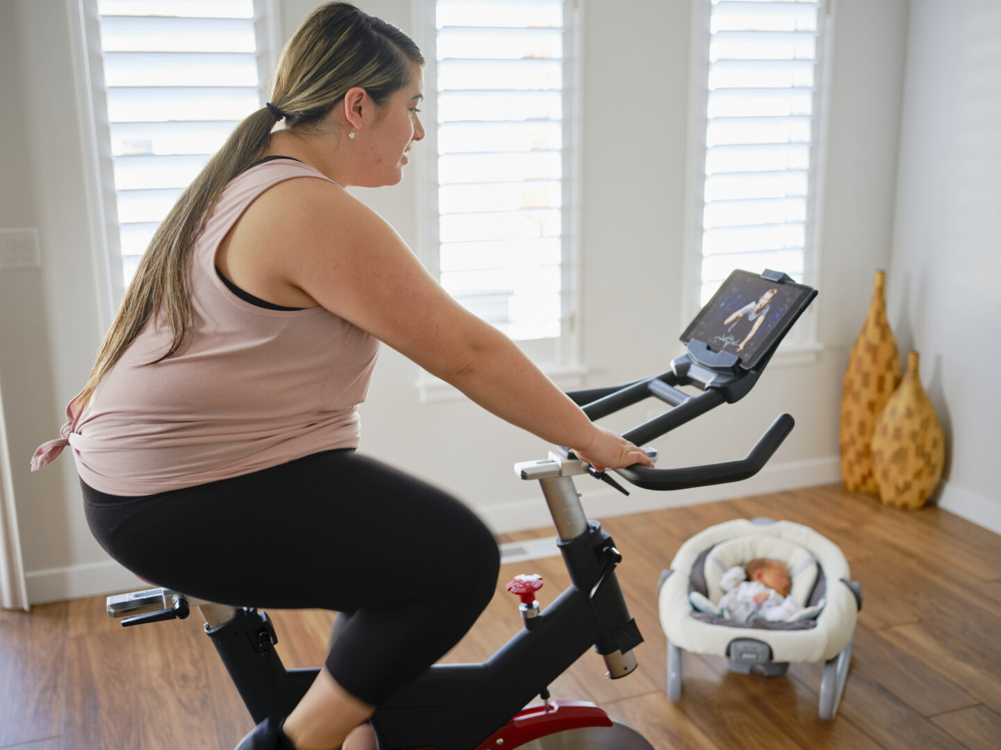 Mother on exercise bike